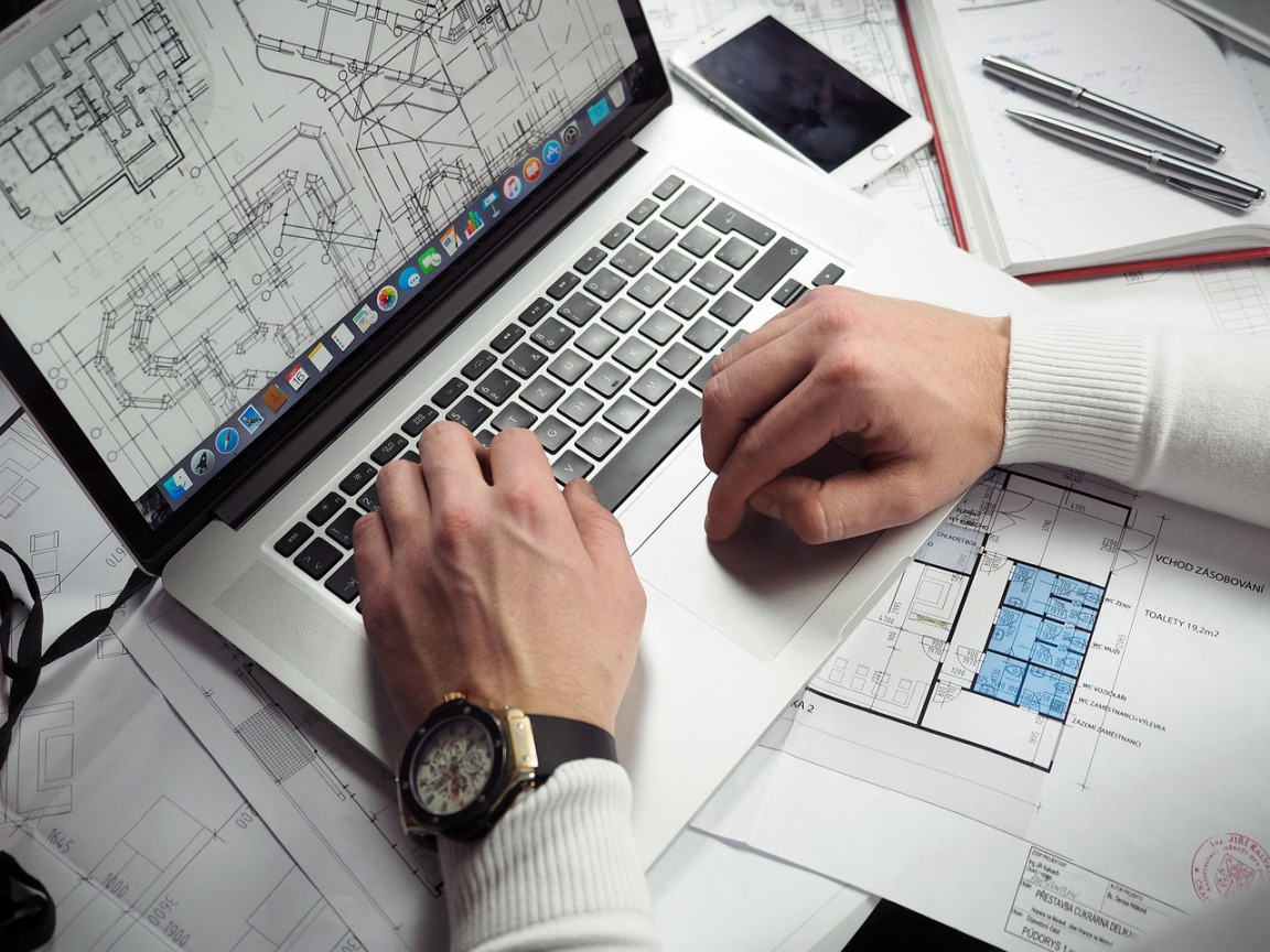 project planning blueprints and scheduling on desk